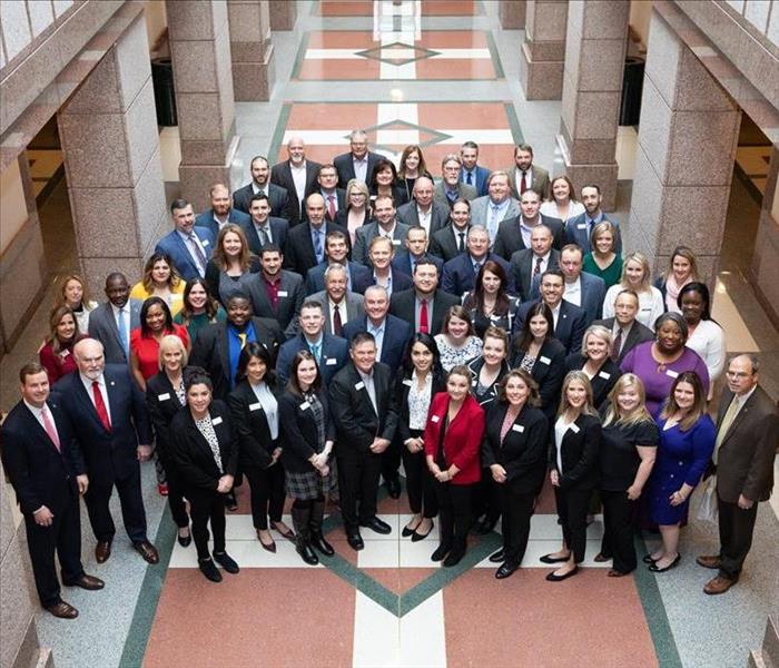 Representatives from Lufkin take a group photo at the Capitol in Austin.