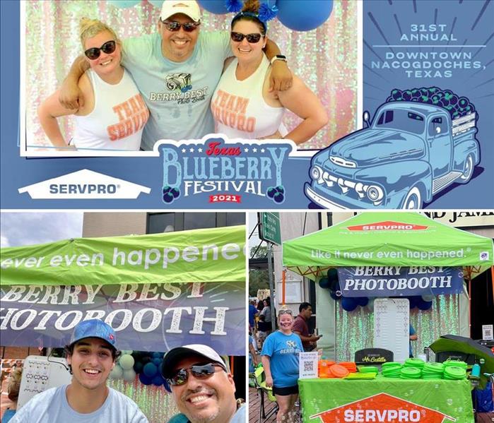 SERVPRO employees posing for picture,  with festival booth
